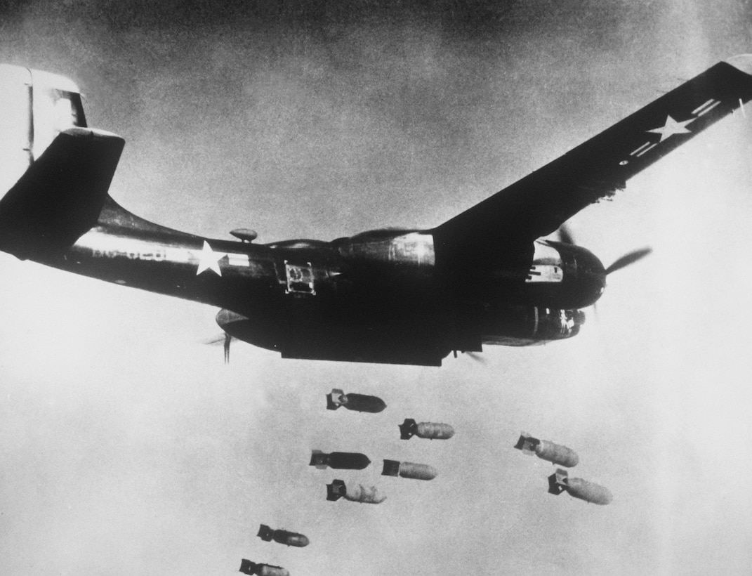 Black-painted U.S. Air Force Douglas B-26C Invader assigned to 3rd Bomb Wing, 5th Air Force, drops bombs over communist target in North Korea, ca. 1953 (Air and Space Museum)