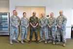 Lt. Col. Teddy Wundenberg, third from left,a maintenance officer for Helicopter Wing 64 of the German Air Force, poses for a photo with the 167th Airlift Wing's Inspector General staff during the 167th AW's deployment training exercise in Alpena, Mich., last June. Lt. Col. James Freid-Studlo, the 167th AW inspector general, second from left,  hosted Wundenberg for about two weeks as part of the Military Reserve Exchange Program.