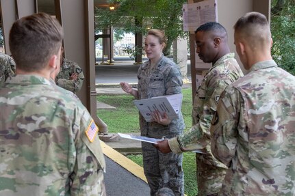 Capt. Whitney Bond, from the Air Force Legal Operations Agency, speaks to Soldiers during de-escalation of force scenario training as part of Operation Faithful Patriot at Joint Base San Antonio-Lackland Oct. 31. Soldiers are deploying in support of Operation Faithful Patriot in order to assist the Department of Homeland Security and Customs and Border Patrol officers along the south-western border of the U.S. and Mexico.