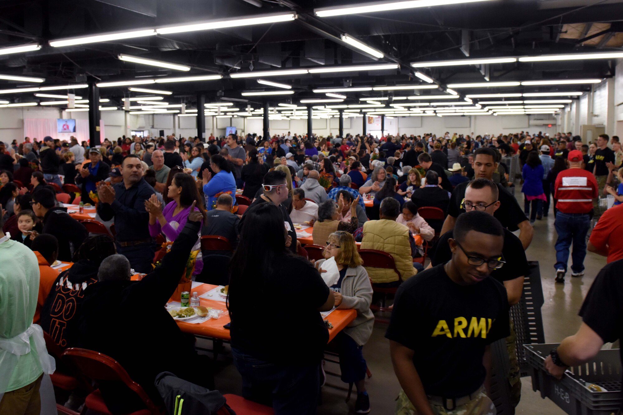Soldiers from Goodfellow Air Force Base fill trays with food during the Feast of Sharing at the Wells Fargo Pavilion in San Angelo, Texas, Nov. 4, 2018. Goodfellow members volunteered their time for the local event. (U.S. Air Force photo by Senior Airman Randall Moose/Released)