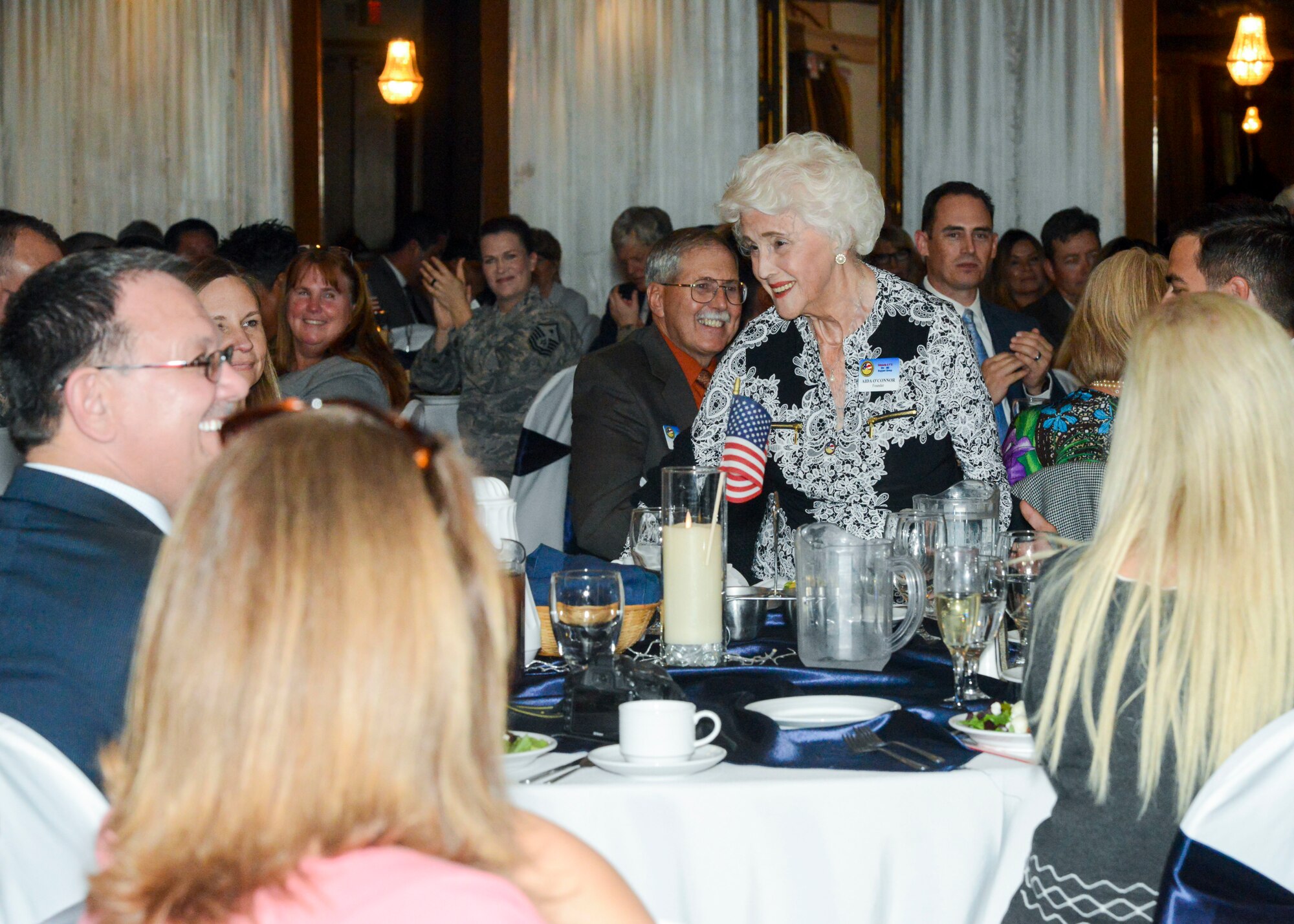 Edwards Air Force Base Civilian-Military Support Group founder, Aida O’Connor, is honored at the Edwards AFB Civ-Mil’s Annual Installation of Officers and Directors dinner banquet at the University of Antelope Valley in Lancaster, California, Nov. 2. (U.S. Air Force photo by Giancarlo Casem)