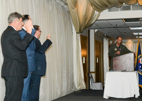 Brig. Gen. E. John Teichert, 412th Test Wing commander, swears-in the officers of the Edwards Air Force Base Civilian-Military Support Group during their Annual Installation of Officers and Directors dinner banquet at the University of Antelope Valley in Lancaster, California, Nov. 2. (U.S. Air Force photo by Giancarlo Casem)