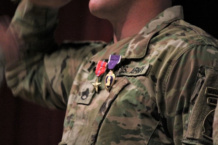 The Adjutant General of Colorado U.S. Air Force Maj. Gen. Mike Loh and Battalion Commander Lt. Col. Joseph A. Bauldry prepare to pin the Green Beret’s with awards during a valor awards ceremony at McMahon Auditorium at Fort Carson, Colo., Sept. 16, 2018, for Company B, 5th Battalion, 19th Special Forces Group (Airborne). (Photo by Sgt. 1st Class Aleah M. Castrejon)