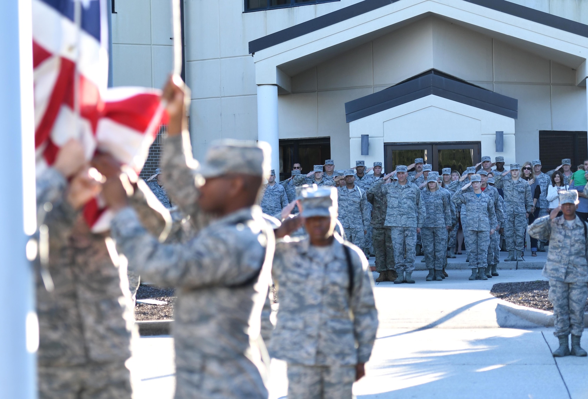 U.S. Air Force Chief Master Sgt. Kenneth Carter, 81st Training Wing command chief, and Keesler Airmen render a salute during a retreat ceremony at Keesler Air Force Base, Mississippi, Nov. 2, 2018. The ceremony was held in honor of Carter who retired with more than 29 years of military service. (U.S. Air Force photo by Kemberly Groue)