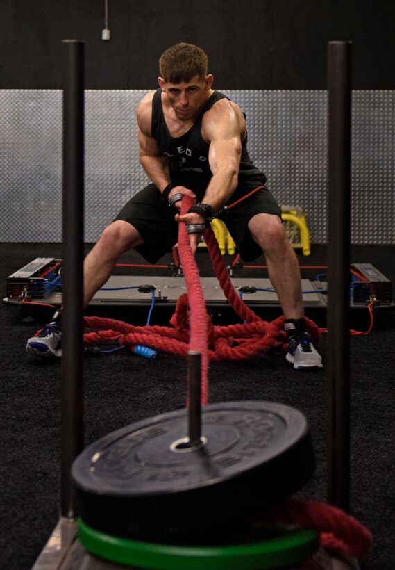 U.S. Air Force Staff Sgt. Tyler McGuire, 66th Training Squadron Survival Evasion Resistance Escape specialist, performs strength training during his morning workout in Spokane Valley, Washington, Oct. 30, 2018. McGuire is preparing for his first Mixed Martial Arts world title match in Indonesia Nov. 17 against Zebaztian “The Bandit” Kadestam, Swedish MMA professional. (U.S. Air Force photo/Airman 1st Class Jesenia Landaverde)