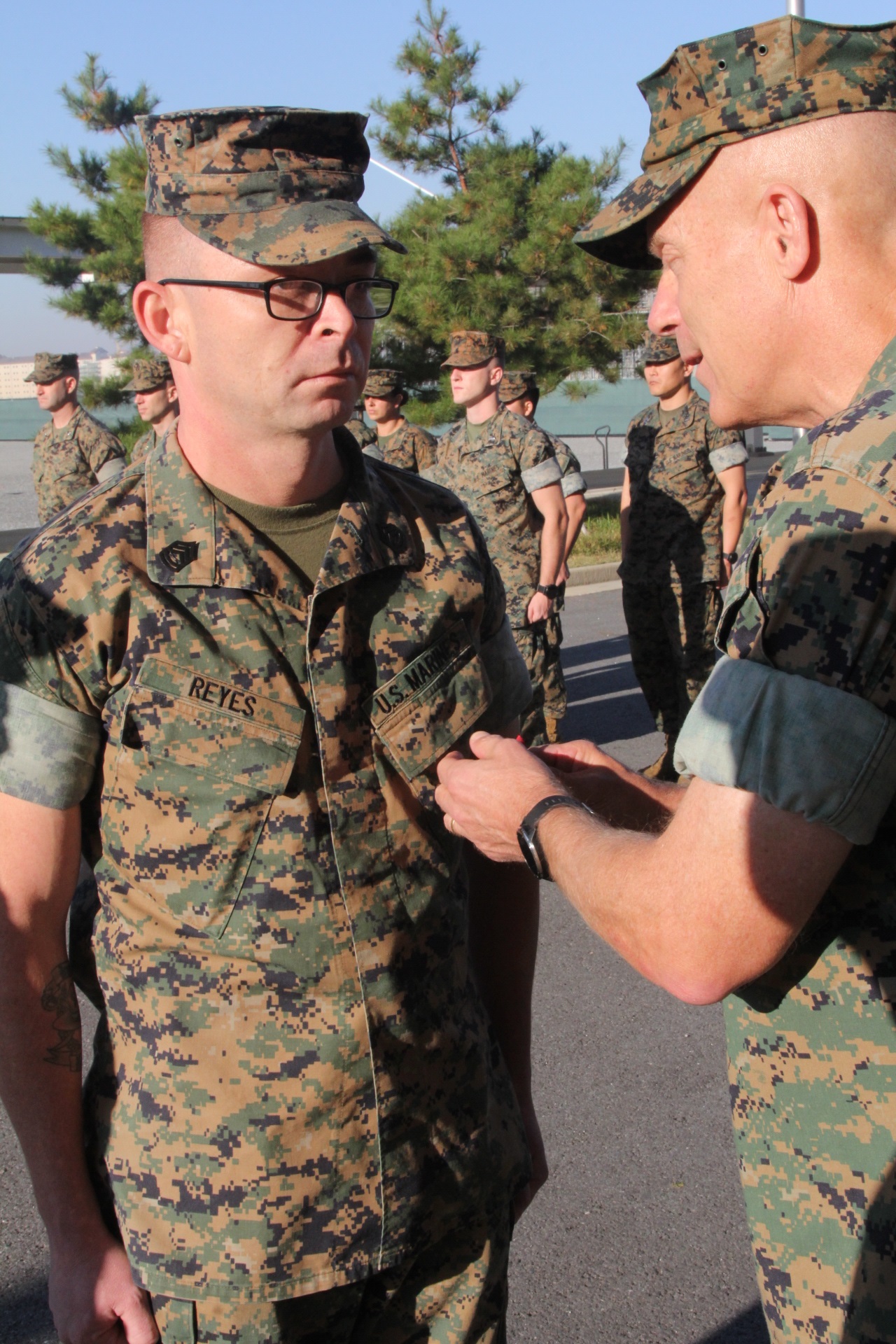 CAMP HUMPHREYS, Republic of Korea – Maj. Gen. Patrick J. Hermesmann (right), commander of U.S. Marine Corps Forces Korea, awards Gunnery Sgt. Roger Reyes, MARFORK G-4 ammunition chief, a Good Conduct Medal here, Nov. 1. MARFORK awarded Reyes the medal for demonstrating character expected of a Marine within the highest standards of Marine Corps ethos. (U.S. Marine Corps photo by Staff Sgt. Anthony Kirby/Released)