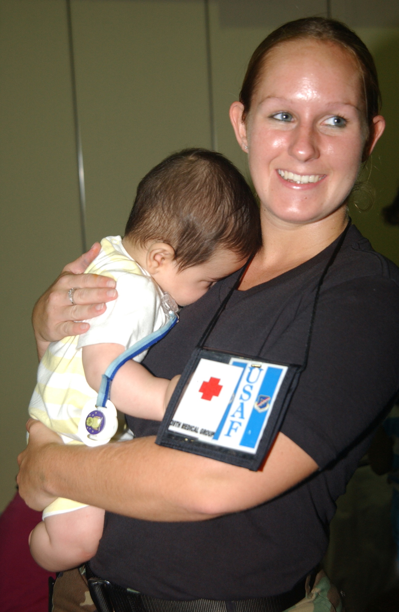 Incirlik Air Base Historical photo of Senior Airman Kylee Wright assists incoming families from Lebanon by holding a baby at incirlik Air Base, Turkey,2006.