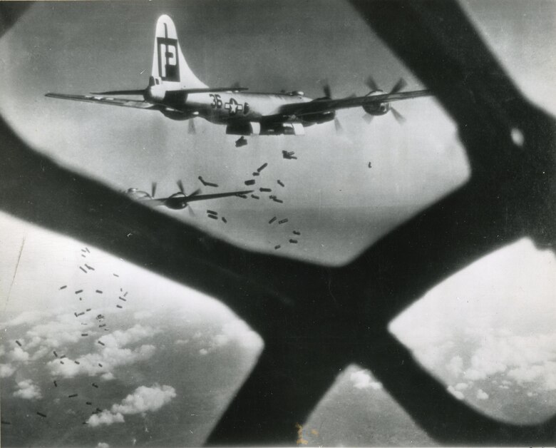 Incirlik Air Base Historical photo of B-29 Superfortress aircraft dropping munitions over Imperial Japan during WWII.