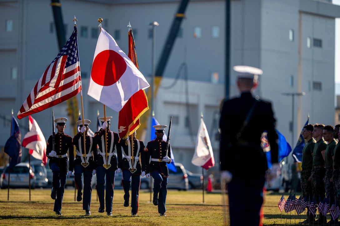 U.S. Marines and Sailors take part in the 243rd Marine Corps birthday uniform pageant at Marine Corps Air Station Iwakuni, Japan, Nov. 5, 2018. The annual ceremony was held in honor of the 243rd Marine Corps birthday. It included a historical uniform pageant to honor Marines of the past, present and future while signifying the passing of traditions from one generation to the next.