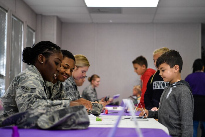 An Airman stamps a passport in a deployment line, Nov. 3, 2018, at Joint Base Charleston, S.C.