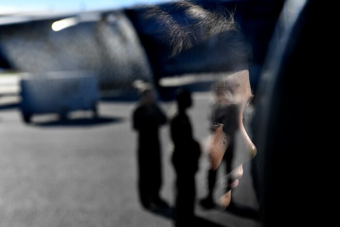 A youth center member looks at a C-17 Globemaster III during a mock deployment, Nov. 3, 2018, at Joint Base Charleston, S.C.
