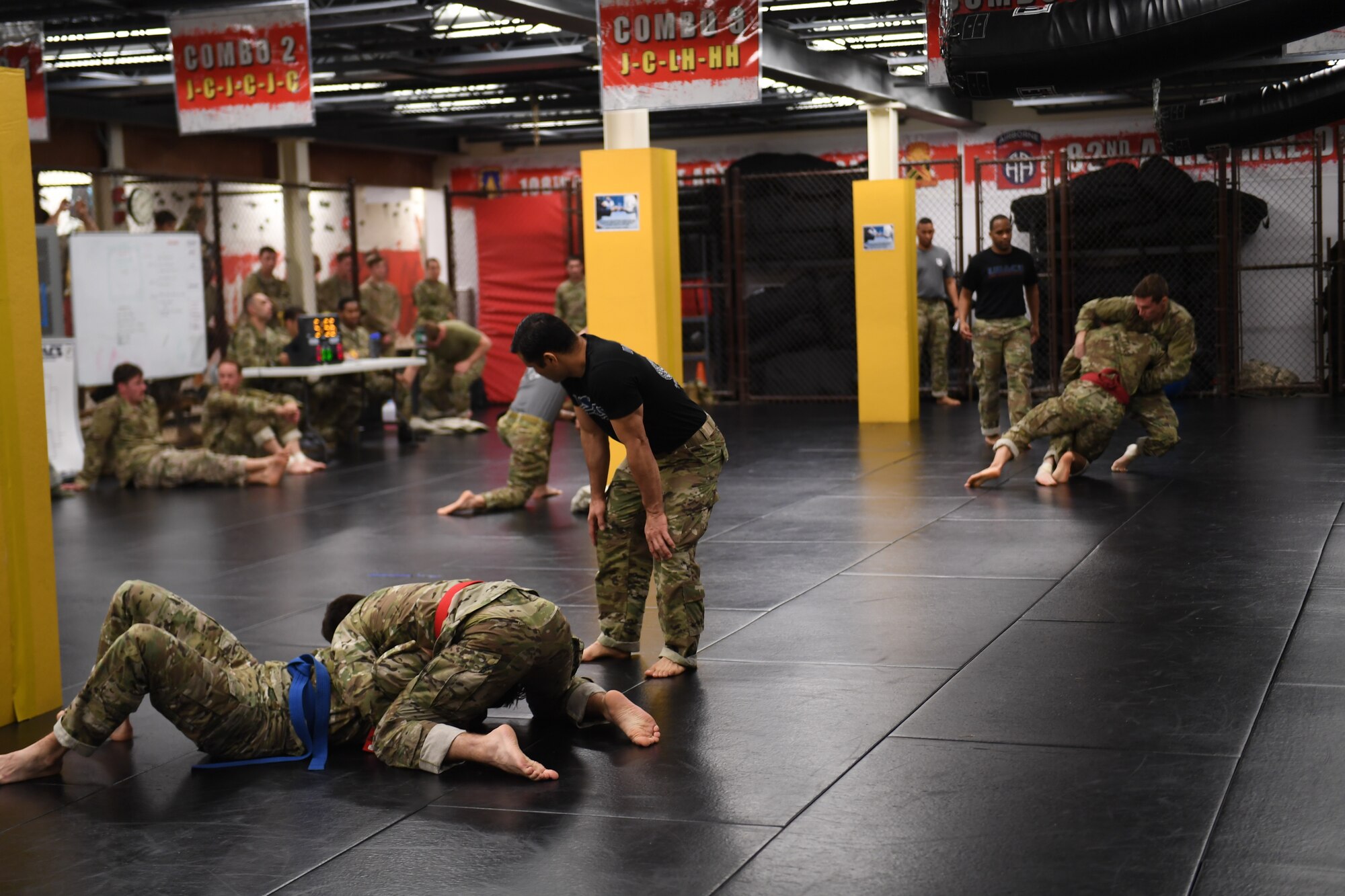 Two pairs of competitors fight simultaneously during the combatives tournament at the Dragon Challenge 2018 at Fort Bragg, North Carolina, Nov. 1, 2018. The combatives tournament was the final event in the three-day competition. Airmen attempted to submit their opponents within six minutes to win the fight. (U.S. Air Force photo by 1st Lt. Faith Brodkorb)