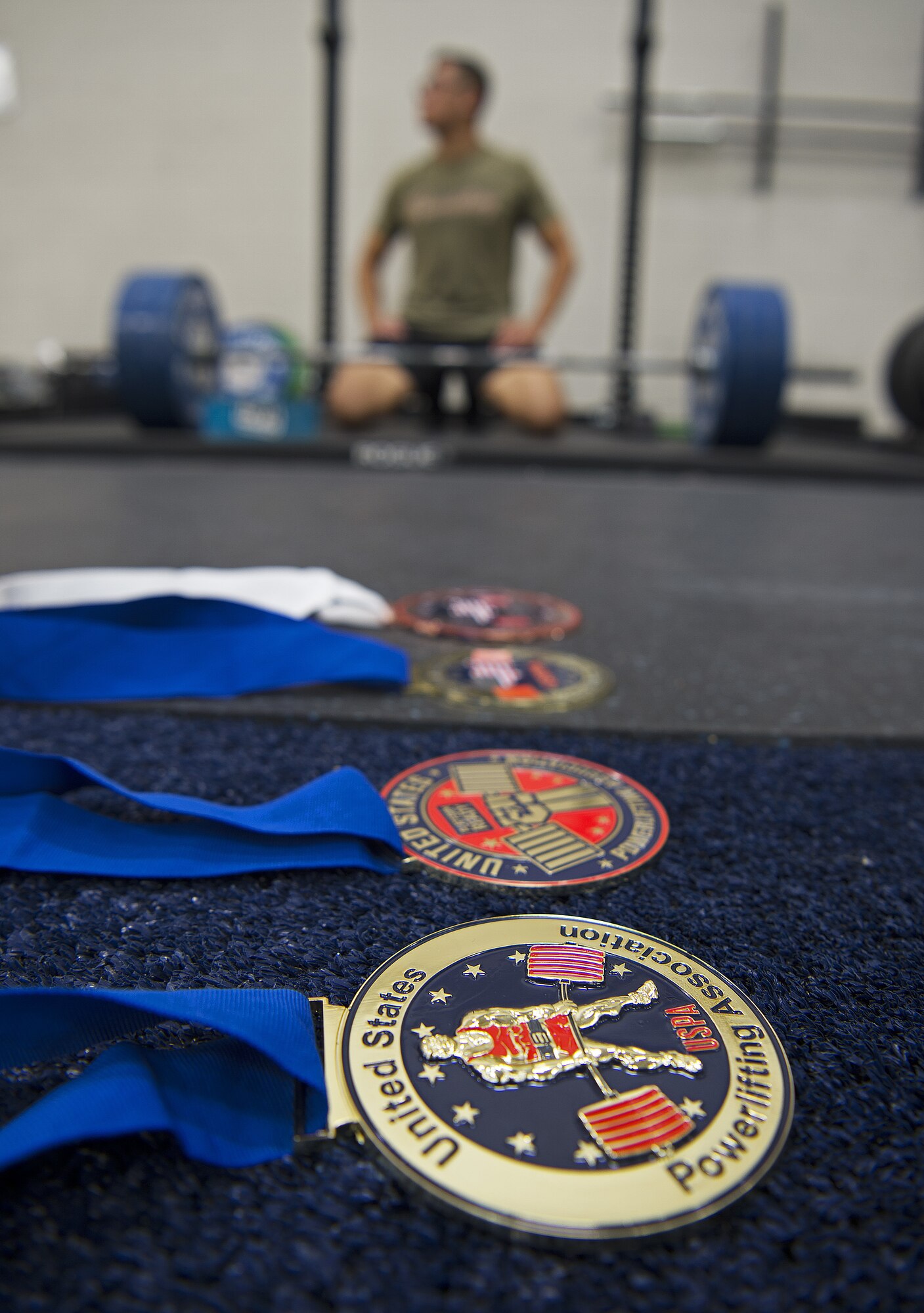 U.S. Air Force Staff Sgt. Allen Plata, 20th Equipment Maintenance Squadron stockpile management crew chief, displays his achievements at Shaw Air Force Base, S.C., Nov. 1, 2018.