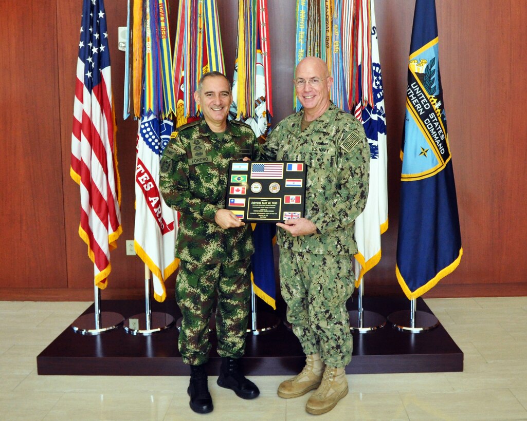 U.S. Southern Command (SOUTHCOM) Exercises and Coalition Director Colombian Army Brig. Gen. Juan Pablo Forero presents plaque of appreciation to Adm. Kurt Tidd