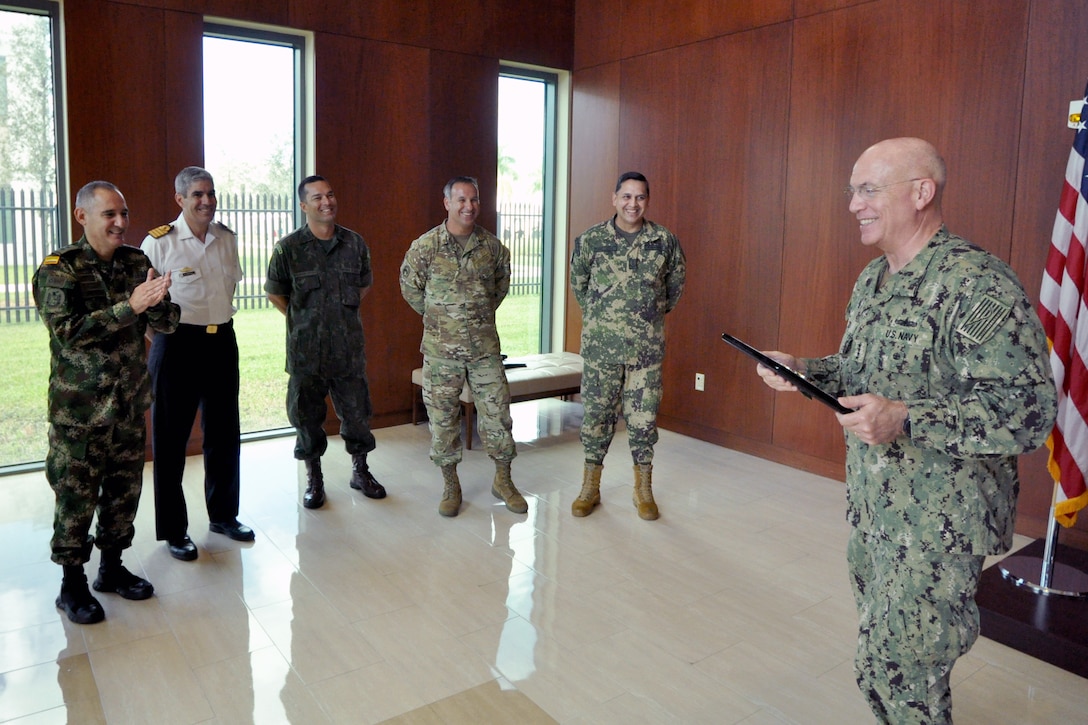 Adm. Kurt Tidd, Commander, U.S. Southern Command (SOUTHCOM), addresses Partner Nation Liaison Officers (PNLOs) assigned to SOUTHCOM after receiving a plaque of appreciation for his leadership and tireless efforts.