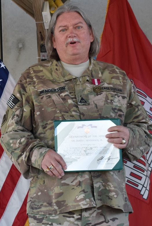 Jim Henderson, Cost Engineer with the Afghanistan District displays his well-deserved Superior Civilian Service Award.