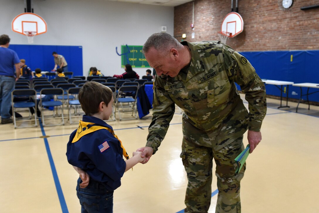 Sgt. David Lietz, public affairs sergeant with the 85th Support Command, meets a student from Lyon Elementary School during the school’s Veteran’s Day observance in Glenview, Illinois, November 5, 2018.