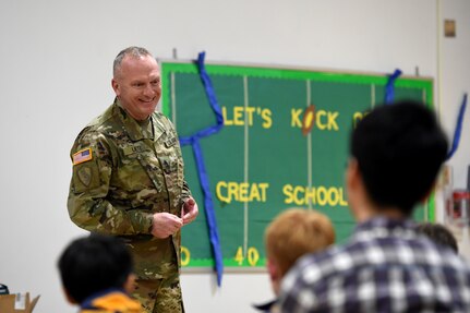 Sgt. David Lietz, public affairs sergeant with the 85th Support Command, speaks with students about his service during the Lyon Elementary School Veteran’s Day observance in Glenview, Illinois, November 5, 2018.