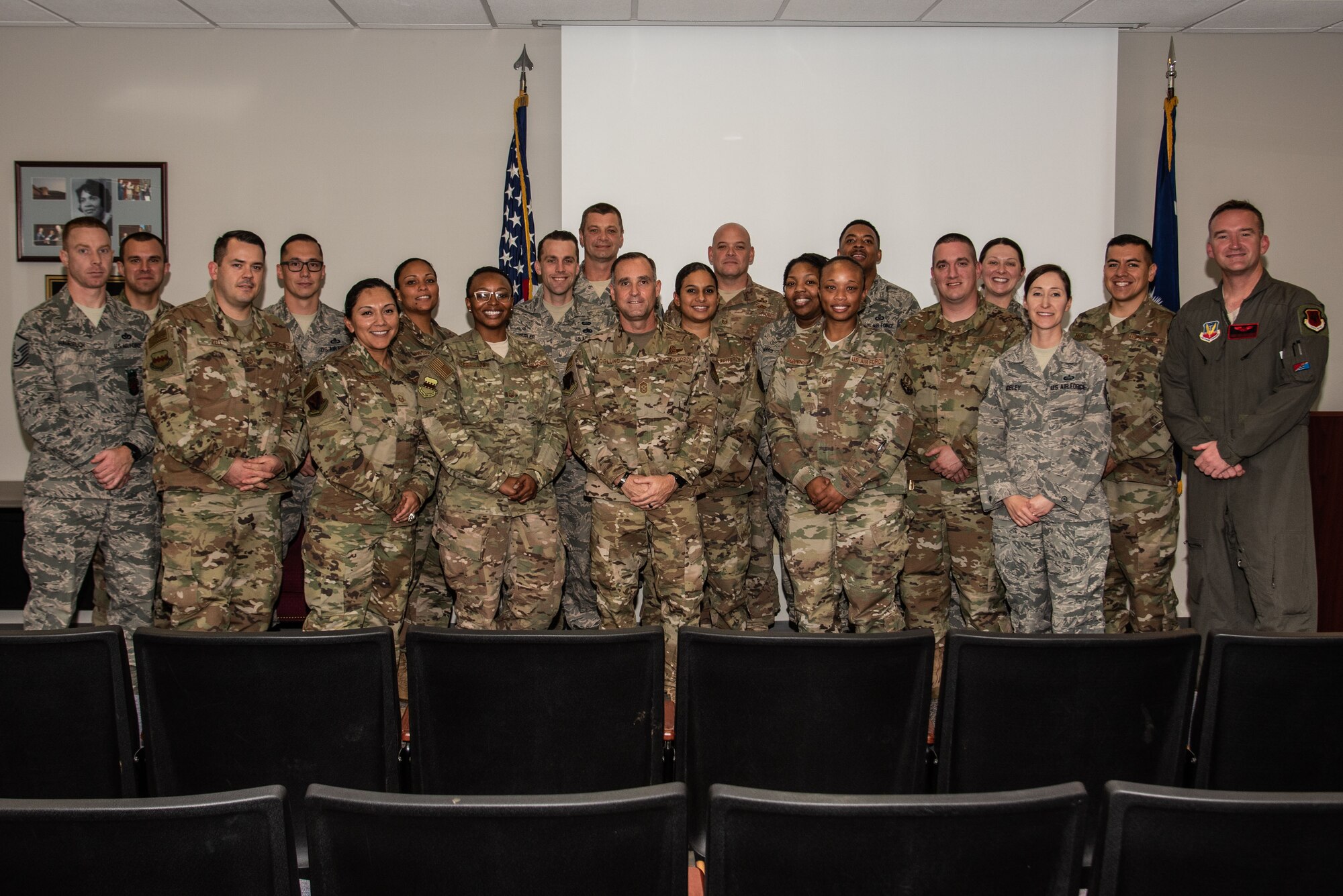 The graduates of a superintendent course stand for a group photo with Chief Master Sgt. Daniel Hoglund, 20th Fighter Wing command chief, center, at Shaw Air Force Base, S.C., Nov. 1, 2018.