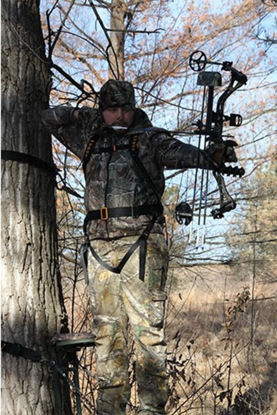 The Kansas City District urges all hunters to wear proper attire and be very conscious of their surroundings. Here a hunter works with a hunting dog.