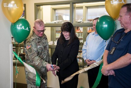 U.S. Army Col. Adam Lange, 673d Air Base Wing vice commander, and Renee Carter-Chapman, University of Alaska Anchorage (UAA) senior vice provost, cut the ribbon during a ceremony at the Joint Base Elmendorf-Richardson Education Center Nov. 2, 2018. The ceremony marks the opening of the academic tutoring room sponsored by the UAA. This room is open to all active-duty personnel, dependents and veterans, no matter which school they attend.