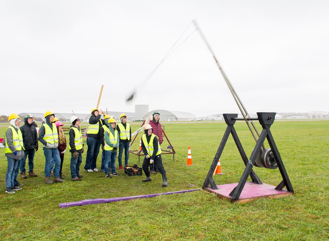 Students from Troy Christian High School watch Nov. 2 as one of their trebuchet-style catapults launches a small pumpkin downrange during the 14th annual Wright-Patterson Air Force Base, Ohio, pumpkin chuck.