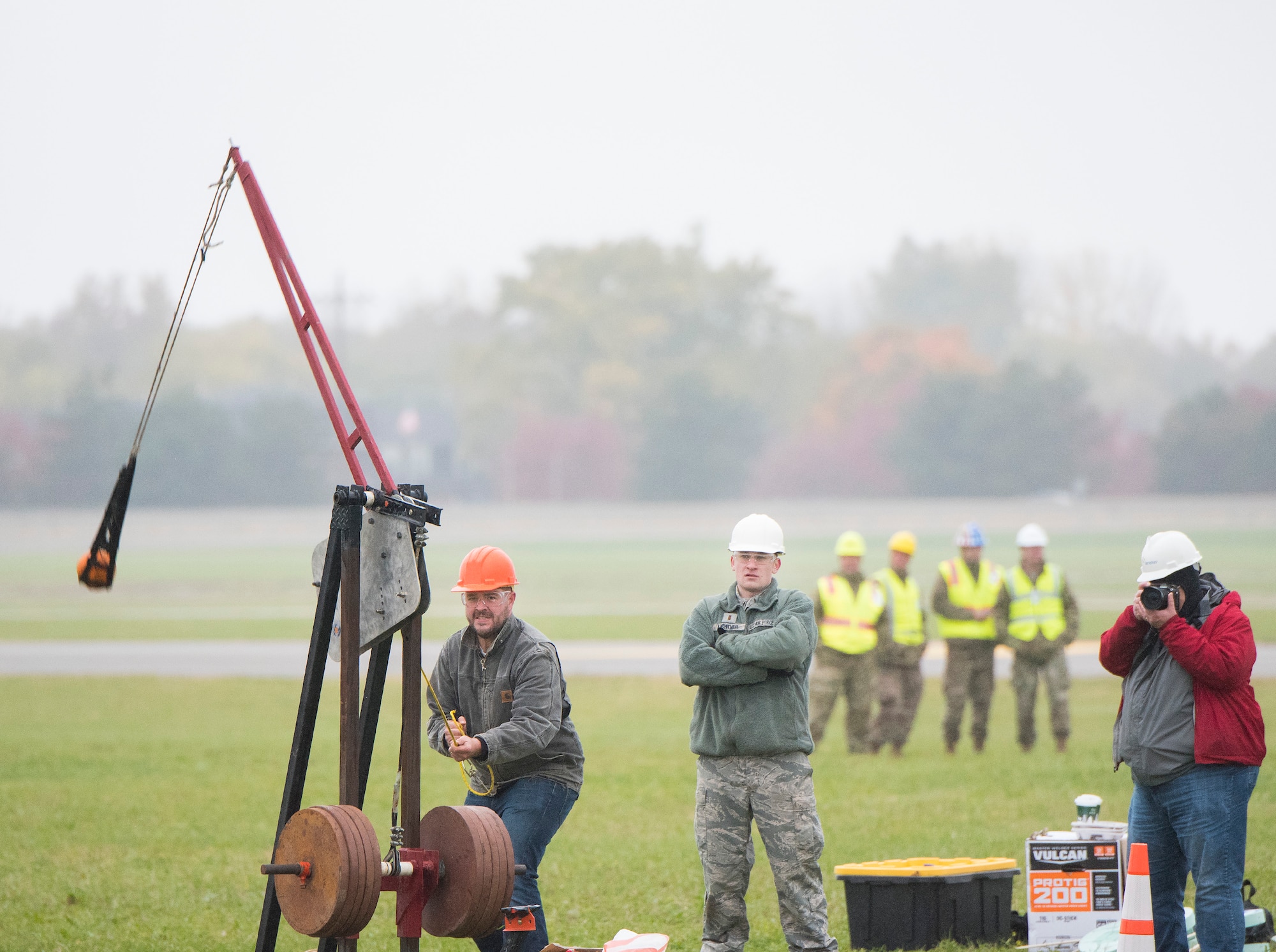 An Air Force Life Cycle Management Center’s F-15 Engineering Branch team member pulls the trigger on their trebuchet-style catapult to hurl a small pumpkin during the 14th annual Wright-Patterson Air Force Base, Ohio, pumpkin chuck Nov. 2.