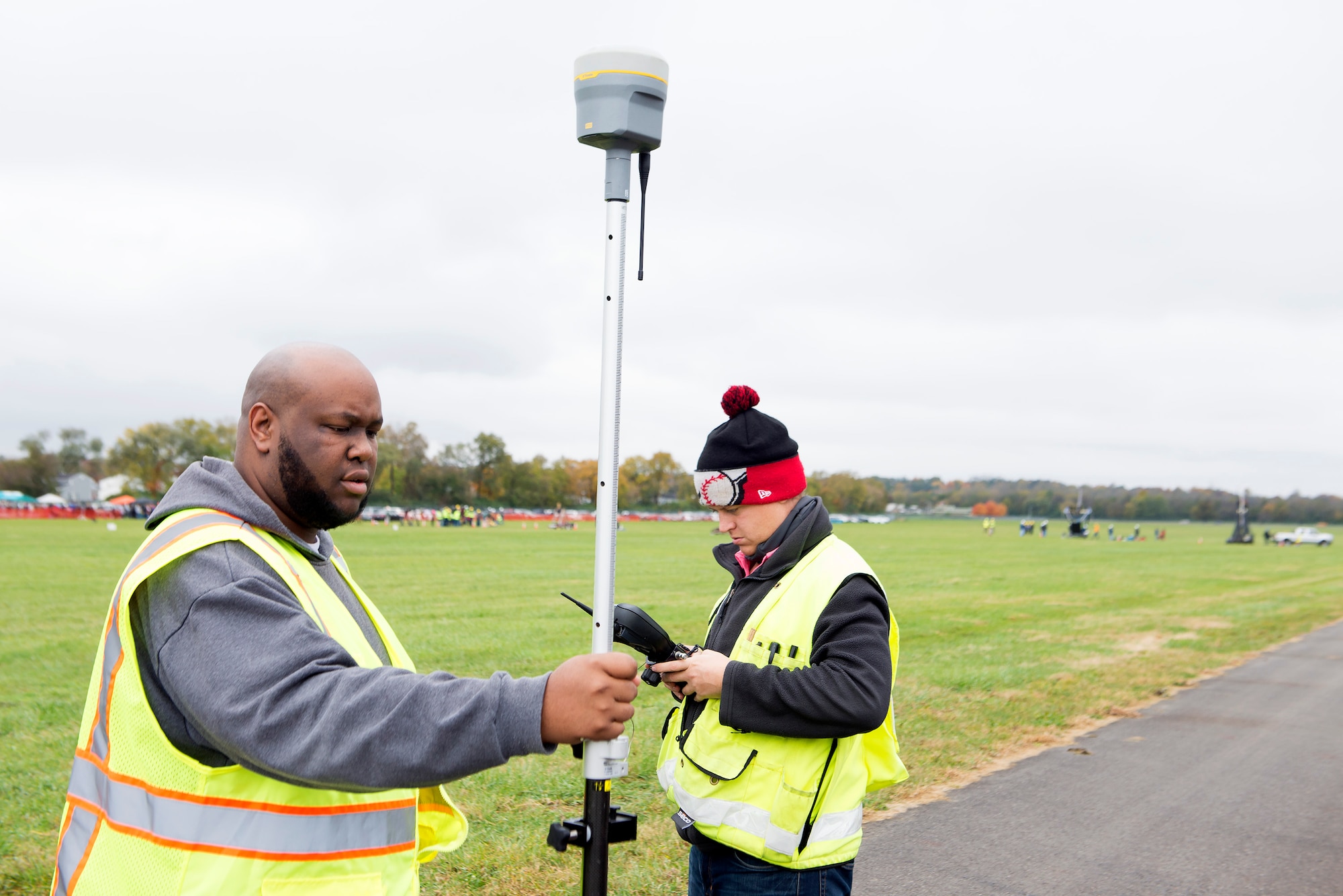 Staff members use GPS surveying equipment to measure the distance a pumpkin was chucked during the 14th annual Wright-Patterson Air Force Base, Ohio, pumpkin chuck Nov. 2.