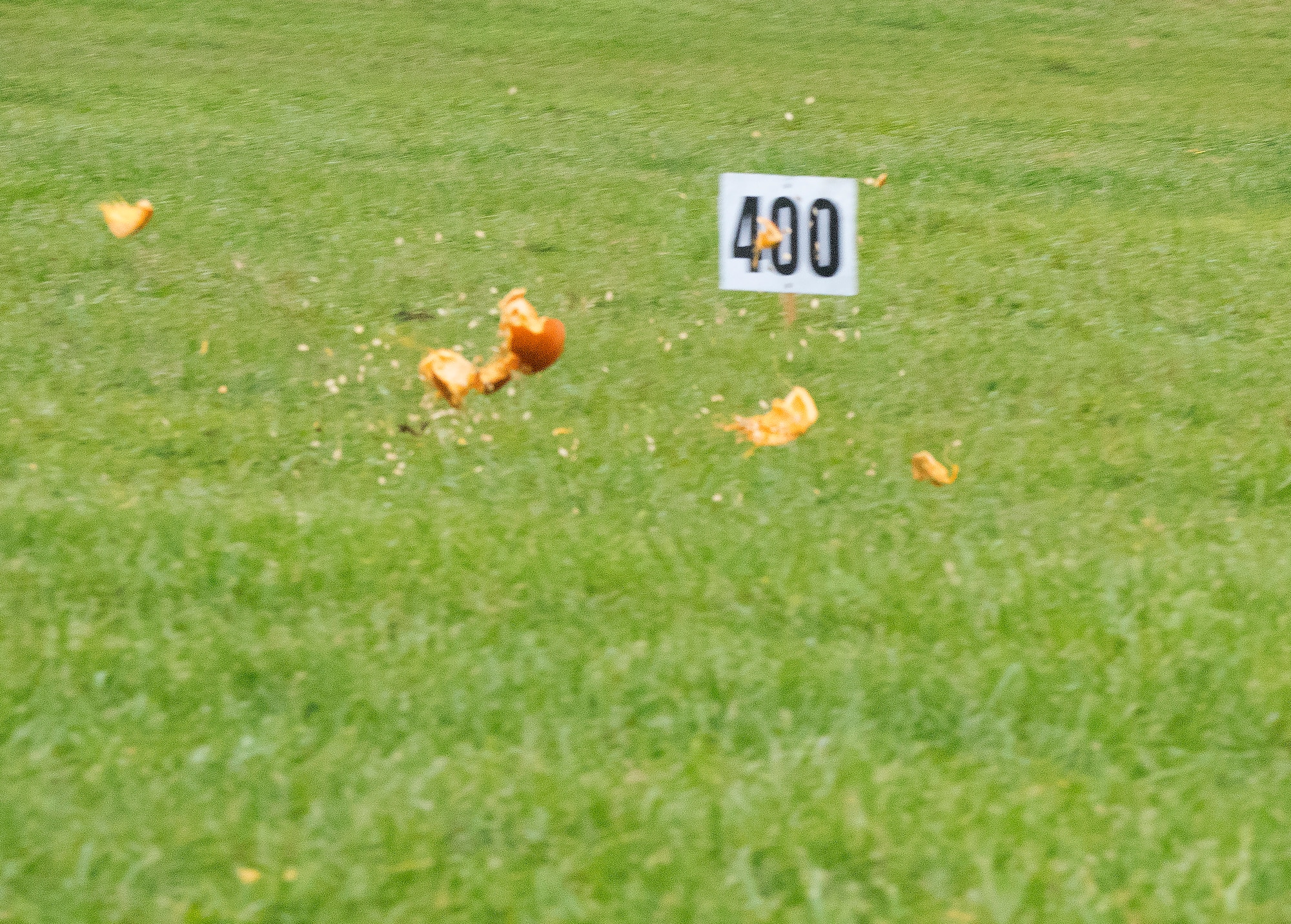 A pumpkin explodes and seeds fly Nov. 2 as it lands approximately 400 feet from where it became airborne during the 14th Annual Wright-Patterson Air Force Base, Ohio, pumpkin chuck.
