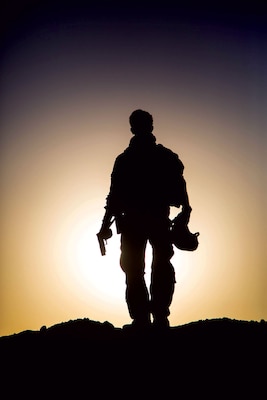 A U.S. soldier in June stands on a mound before taking part in a handgun night fire range near the Iraq-Syria border. Iraqi Security Forces and Coalition partners provided fire support and continually work on combat skills to assist the Syrian Democratic Forces as they continued Operation Roundup, the military offensive to rid the final pockets of the ISIL terrorist organization from the Middle Euphrates River Valley in Syria. (U.S. Army/ Anthony Zendejas IV)