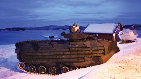 A Marine amphibious assault vehicle hits the beach through the Namsos fjord in March 2016 to support NATO allies and partners during the final training of Exercise Cold Response 16. The cold-weather training integrated air, land, and sea capabilities of 13 nations and more than 15,000 troops to improve capacity to coordinate and respond to threats as a team.