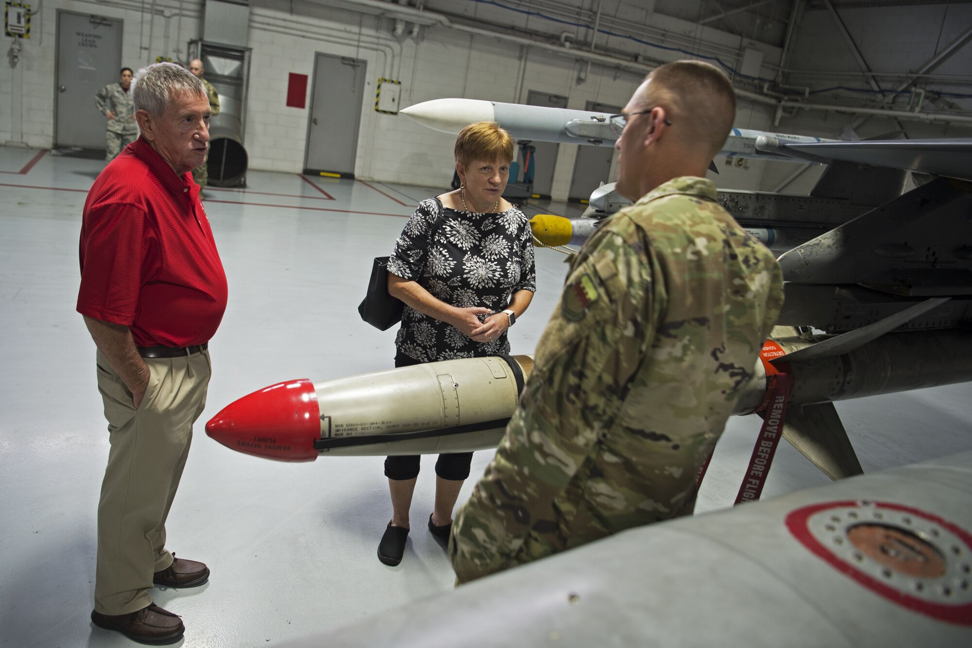 Retired Chief Master Sgt. Kevin Foulois, great-nephew of the late retired Maj. Gen. Benjamin Foulois, speaks with Chief Master Sgt. Jon Young, 20th Maintenance Group wing weapons manager, at Shaw Air Force Base, S.C., Nov. 2, 2018.