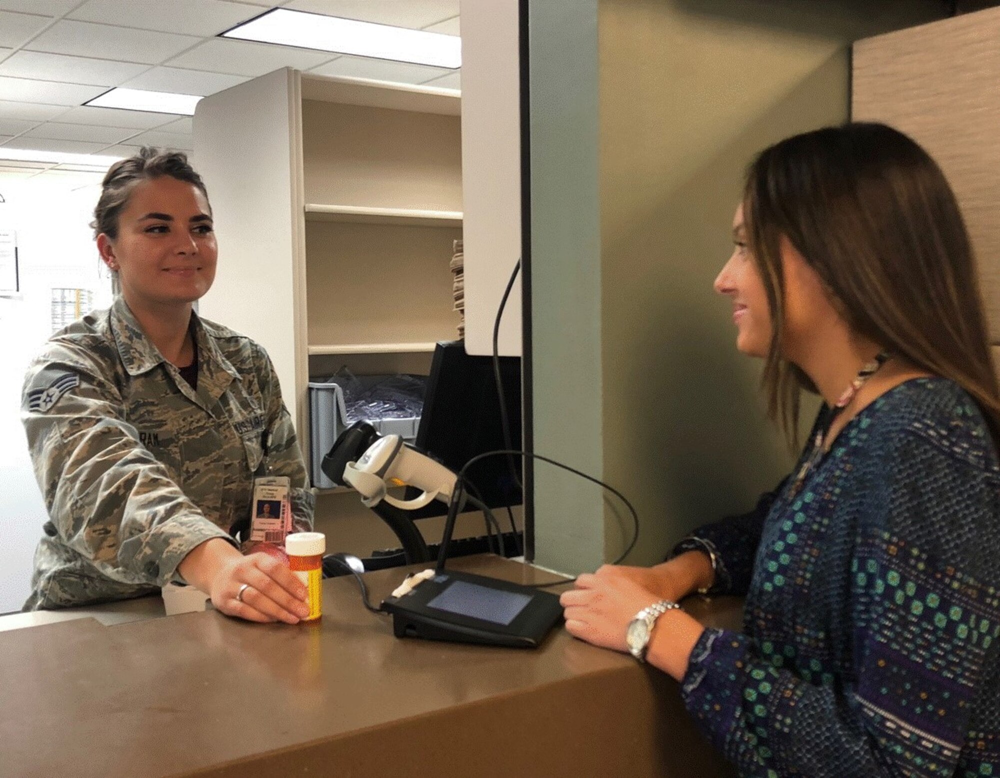 SrA Yana Ingram, a Pharmacy Technician with the 97th Medical Group, fills a prescription at the Altus Air Force Base pharmacy in Oklahoma. Ingram found her way to the US Air Force from a Ukrainian orphanage.