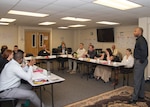 Brandon Greenwood (right), Exceptional Family Member Program System Navigator, leads a discussion about family support with program delegates during the Armed Forces Action Plan held at the Joint Base San Antonio-Fort Sam Houston Military & Family Readiness Center Oct. 28.  The event brings people together to discuss issues that concern military families living on post.
