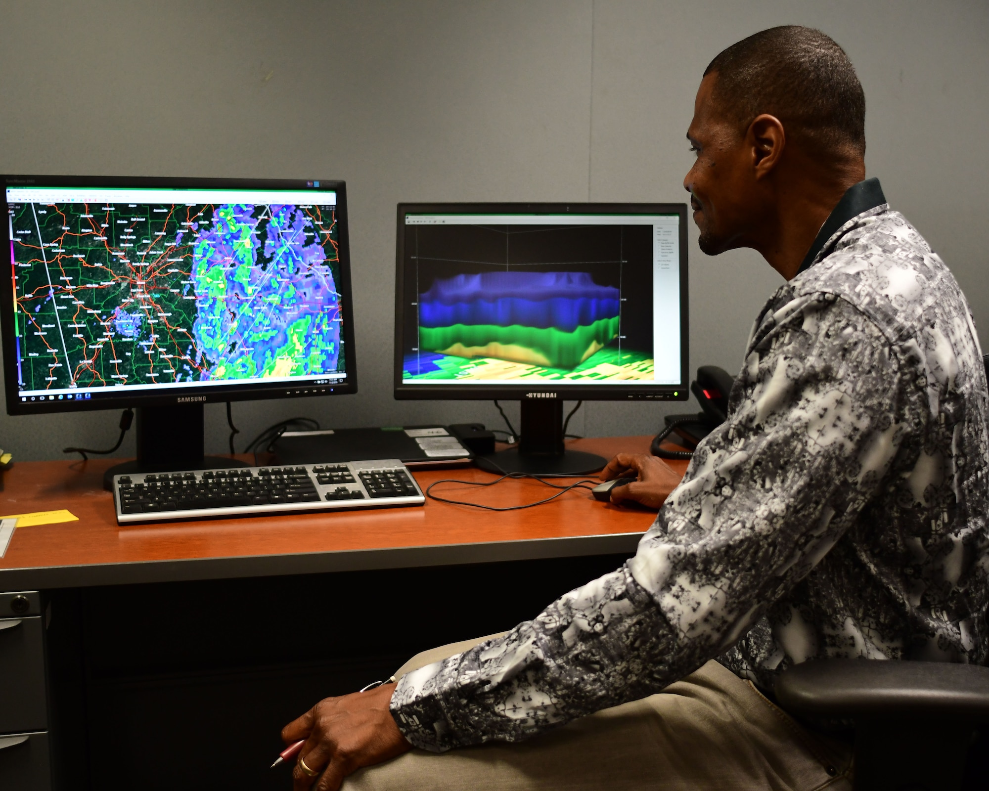 Lloyd Johnson, 94th Operations Group meteorologist technician, looks at a weather radar at Dobbins Air Reserve Base, Georgia, Nov. 2, 2018. Brig. Gen. Richard Kemble, 94th Airlift Wing commander, recently presented Johnson with a letter from AFRC announcing Johnson as this year’s weather civilian of the year. (U.S. Air Force photo/Staff Sgt. Andrew Park)