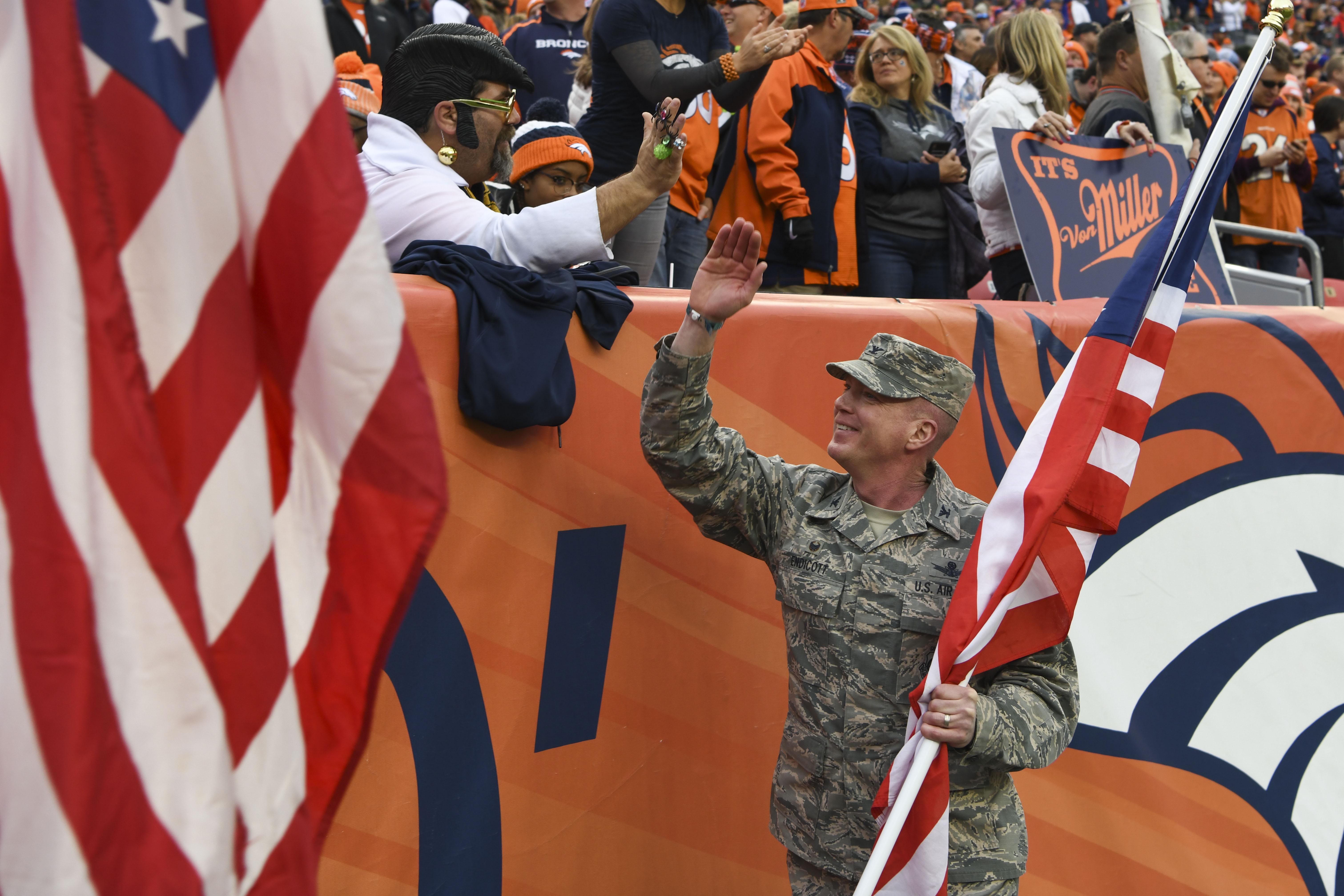 Broncos salute outlet to service 2018