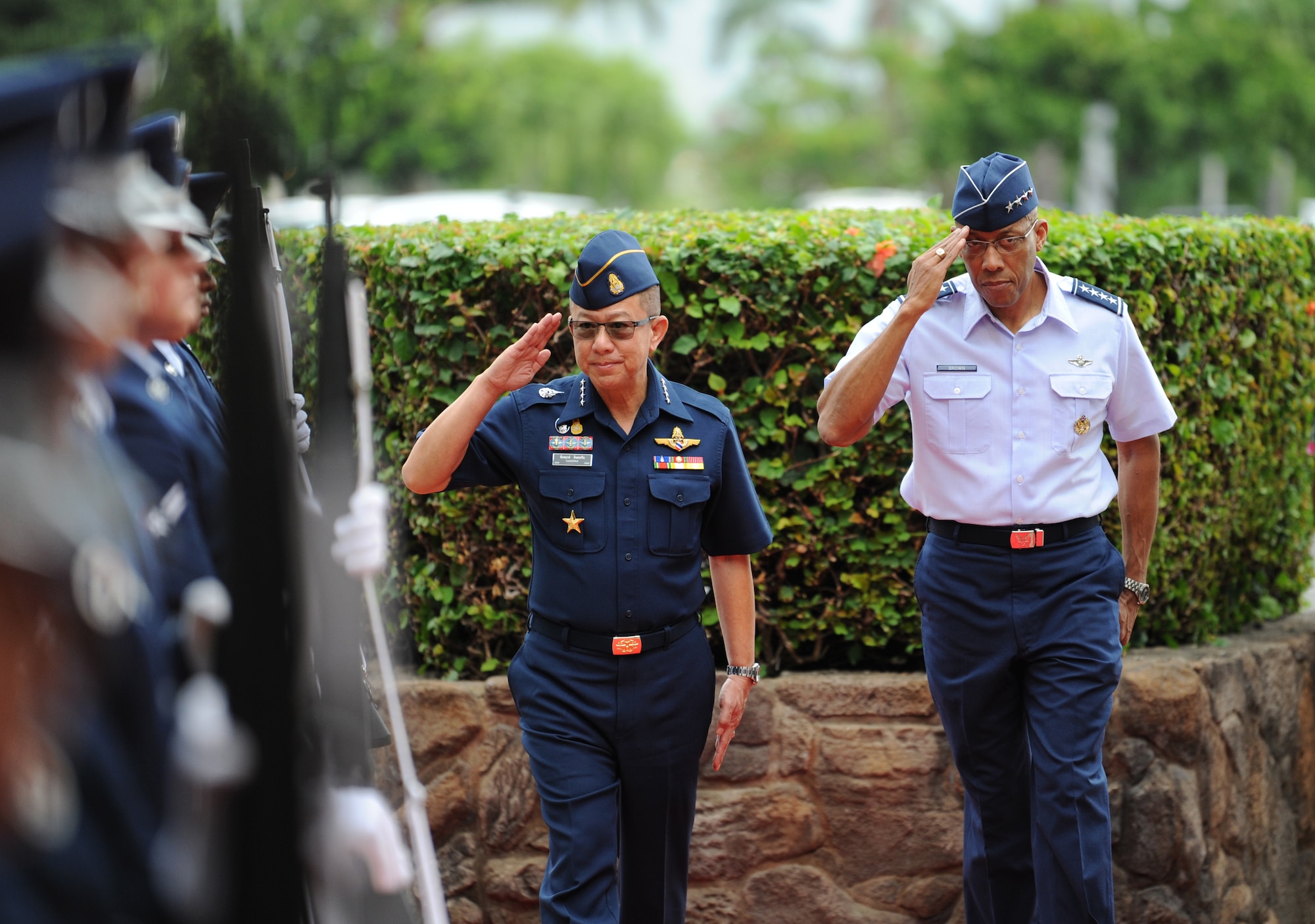 Commander-in-Chief of the Royal Thai air force Chief Air Marshal Chaiyapruk Didyasarin, and U.S. Air Force Commander of Pacific Air Forces (PACAF), Gen. CQ Brown, Jr., salute the honor cordon during a visit to Headquarters PACAF, Joint Base Pearl Harbor-Hickam, Hawaii, Oct. 29, 2018.