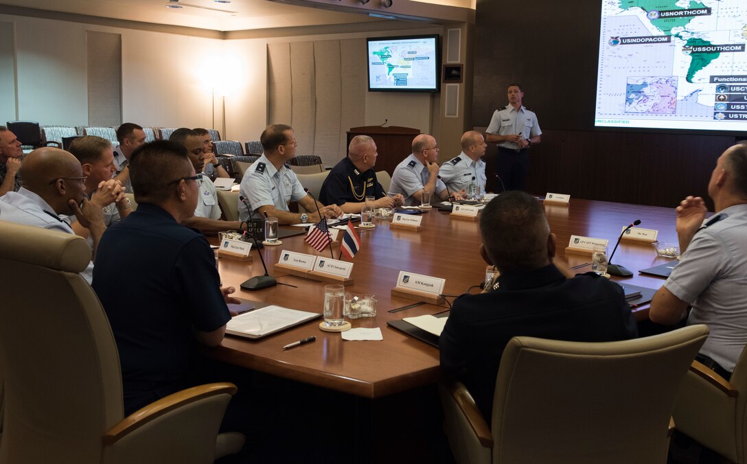Commander-in-Chief of the Royal Thai air force Chief Air Marshal Chaiyapruk Didyasarin, and U.S. Air Force Commander of Pacific Air Forces (PACAF), Gen. CQ Brown, Jr., receive a briefing at Headquarters PACAF, Joint Base Pearl Harbor-Hickam, Hawaii, Oct. 29, 2018.