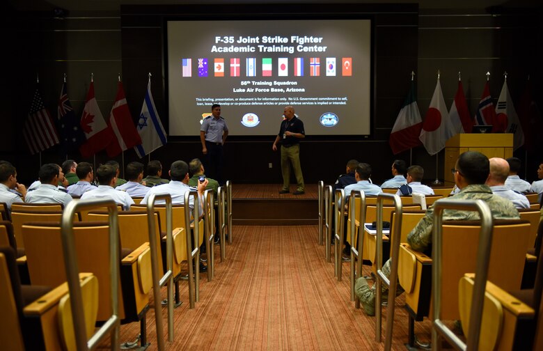 Distinguished cadets from different Latin American Air Force academies receive a brief on the mission of the F-35 Academic Training Center Oct. 31, 2018, at Luke Air Force Base, Ariz. The cadets, the top two from each of their respective nation’s air service academies, visited Luke as part of the Department of Defense Latin American Cadet Initiative program, which takes the cadets on tours through bases across the country. (U.S. Air Force photo by Senior Airman Ridge Shan)