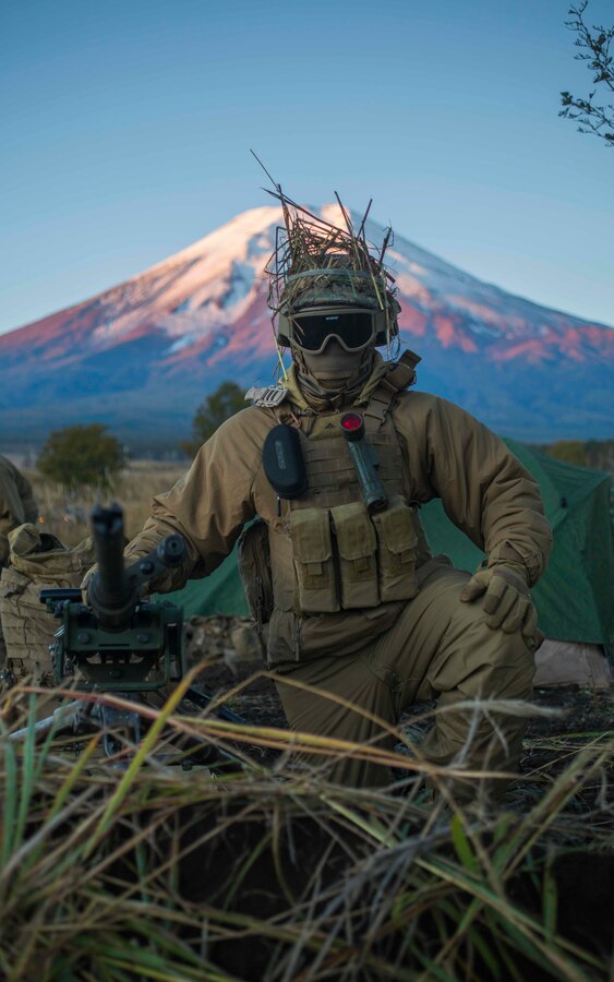 Lance Cpl. Stevie Harrison, a motor vehicle operator with Truck Company, Headquarters Battalion, 3rd Marine Division, takes post on a Browning .50 Caliber Machine Gun during Artillery Relocation Training Program 18-3 October 25, 2018, on the Combined Arms Training Complex, Camp Fuji, Japan.  ARTP 18-3 allows Marines with 3rd Battalion, 12th Marine Regiment, 3rd Marine Division, III Marine Expeditionary Force, based off of Camp Hansen Okinawa, Japan to sharpen their understanding for their job field. (U.S. Marine Corps Photo by Lance Cpl. Cameron Parks)