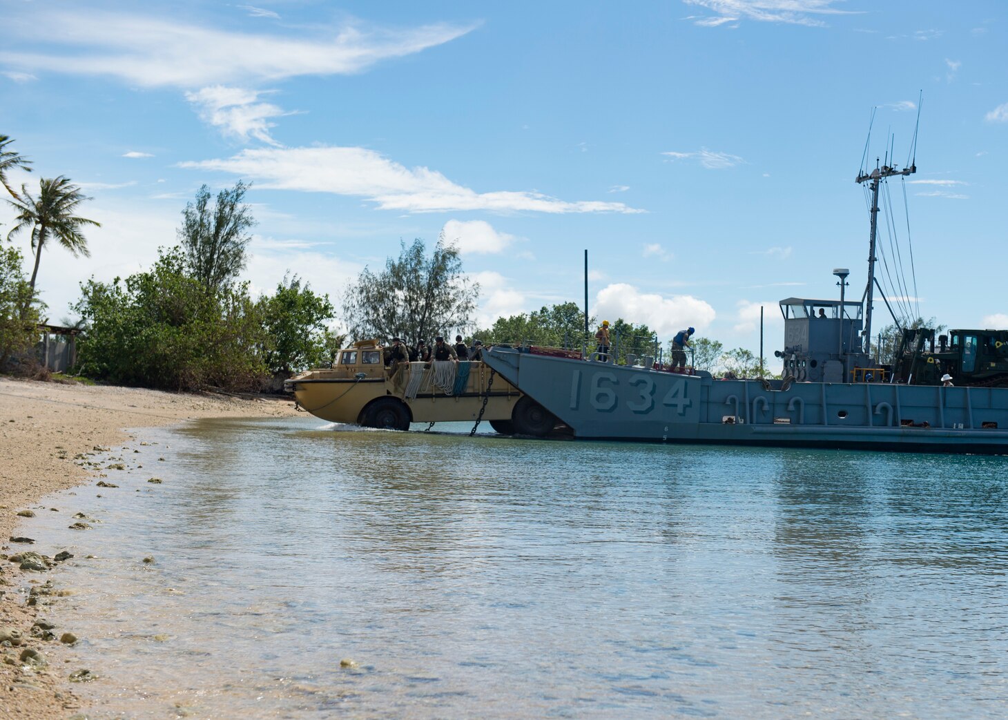 SANTA RITA, Guam (Nov. 06, 2018) Landing craft utility (LCU) 1634, assigned to Naval Beach Unit (NBU) 7 forward-deployed to Sasebo, Japan, embarked aboard amphibious dock landing ship USS Ashland (LSD 48), approaches the landing zone on Naval Base Guam to move heavy equipment trucks and supplies for the Guam Army National Guard headed to support Super Typhoon Yutu relief efforts in the CNMI. Service Members from Joint Region Marianas and U.S. Indo-Pacific Commands are providing Department of Defense support to the Commonwealth of the Northern Mariana Islands civil and local officials as part of the FEMA-supported Super Typhoon Yutu recovery effort.