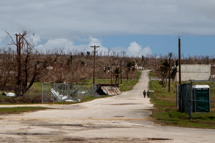 Marines with Combat Logistics Battalion 31 walk along a cleared road during the U.S. Defense Support of Civil Authorities relief effort in response to Super Typhoon Yutu, Tinian, Commonwealth of the Northern Mariana Islands, Nov. 3, 2018. Businesses, government buildings, homes and schools were heavily damaged by Super Typhoon Yutu, which made a direct hit with devastating effect on Tinian Oct. 25 packing 170 MPH winds – it is the second strongest storm to ever hit U.S. soil and the strongest storm of 2018. Marines with the 31st Marine Expeditionary Unit and CLB-31 have been leading a multi-service contingent since Oct. 29 as part of the U.S. Federal Emergency Management Agency-directed DSCA mission here. The Marines arrived at the request of CNMI officials and FEMA to assist relief efforts in the wake of Yutu, the largest typhoon to ever hit a U.S. territory. The 31st MEU, the Marine Corps’ only continuously forward-deployed MEU, provides a flexible force ready to perform a wide-range of military operations across the Indo-Pacific region.