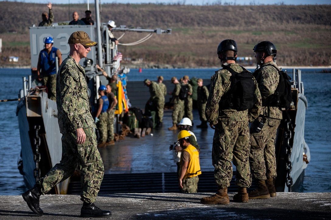 Sailors with the dock landing ship USS Ashland sit pier-side aboard a landing craft at the port during the U.S. Defense Support of Civil Authorities relief effort in response to Super Typhoon Yutu, Tinian, Commonwealth of the Northern Mariana Islands, Nov. 3, 2018. Businesses, government buildings, homes and schools were heavily damaged by Super Typhoon Yutu, which made a direct hit with devastating effect on Tinian Oct. 25 packing 170 MPH winds – it is the second strongest storm to ever hit U.S. soil and the strongest storm of 2018. Marines with the 31st Marine Expeditionary Unit and CLB-31 have been leading a multi-service contingent since Oct. 29 as part of the U.S. Federal Emergency Management Agency-directed DSCA mission here. The Ashland arrived today to deliver a larger contingent of Marines and Seabees to further assist the people of Tinian. The Marines arrived at the request of CNMI officials and FEMA to assist relief efforts in the wake of Yutu, the largest typhoon to ever hit a U.S. territory. The 31st MEU, the Marine Corps’ only continuously forward-deployed MEU, provides a flexible force ready to perform a wide-range of military operations across the Indo-Pacific region.