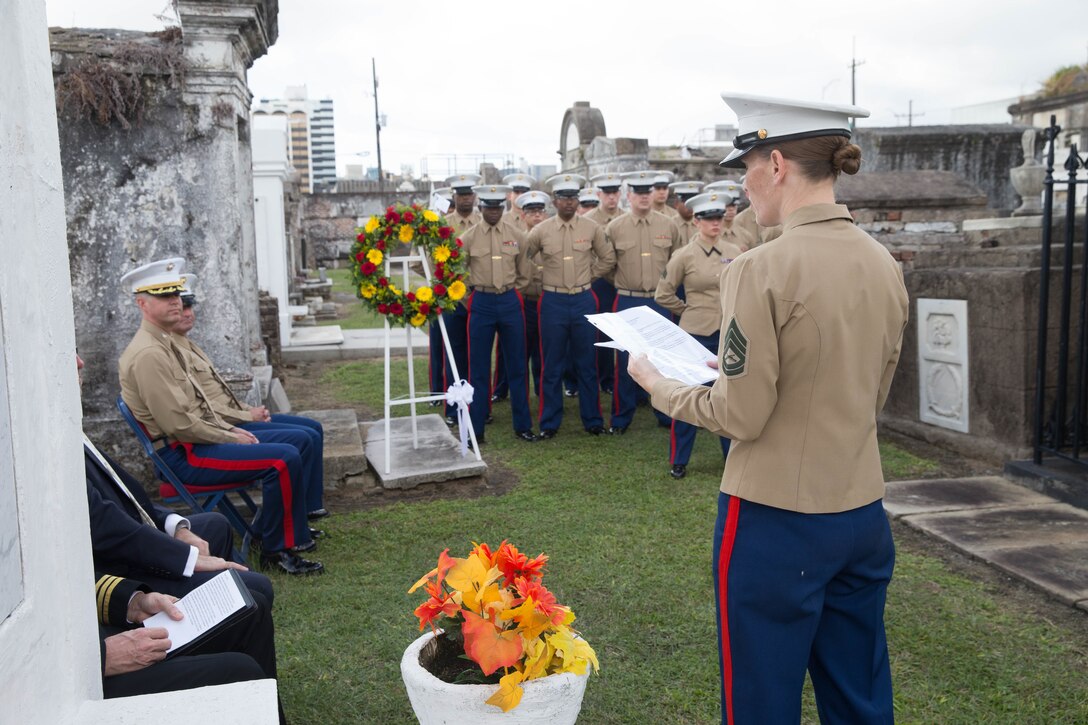 Gunnery Sgt. Emilie B. Osterfeld, administration chief with Marine Forces Reserve, narrates at the gravesite of Marine Corps Maj. Daniel Carmick during a wreath laying ceremony at St. Louis Cemetery No. 2 in New Orleans, Nov. 6, 2018. This ceremony is held annually to celebrate and honor the legacy and actions of Maj. Carmick during the Battle of New Orleans during the War of 1812. Maj. Carmick’s leadership on the battlefield was an essential contribution that resulted in the defeat of British troops and prevented the seizure and conquest of the Louisiana territory. (U.S. Marine Corps photo by Lance Cpl. Samantha Schwoch/released)