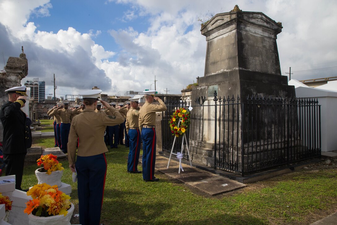 Marines with Marine Forces Reserve salute the gravesite of Marine Corps Maj. Daniel Carmick during the playing of taps at St. Louis Cemetery No. 2 in New Orleans, Nov. 6, 2018. This ceremony is held annually to celebrate and honor the legacy and actions of Maj. Carmick during the Battle of New Orleans during the War of 1812. Maj. Carmick’s leadership on the battlefield was an essential contribution that resulted in the defeat of British troops and prevented the seizure and conquest of the Louisiana territory. (U.S. Marine Corps photo by Lance Cpl. Samantha Schwoch/released)