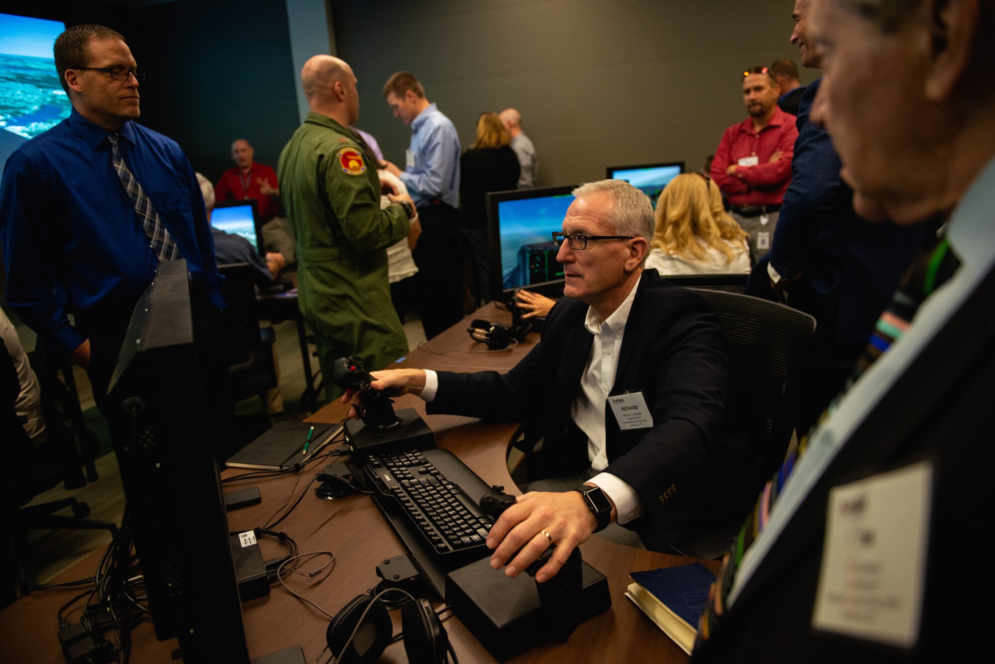 A Personalized Learning Cohort member flies a pilot training simulator during a visit to Luke Air Force Base, Ariz., Nov. 2, 2018. Throughout the tour, members of the cohort were given the opportunity to speak with Airmen and receive a comprehensive review of some of the resources and tools used to train fighter pilots. (U.S. Air Force photo by Senior Airman Alexander Cook)