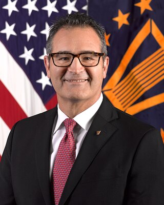 Christopher Kapellas, deputy director, Human Resources Directorate, Washington Headquarter Services, Office of the Secretary of Defense, poses for his official DOD portrait in the Army portrait studio at the Pentagon on Nov. 27, 2013. (U.S. Army photo by Monica King/Released)