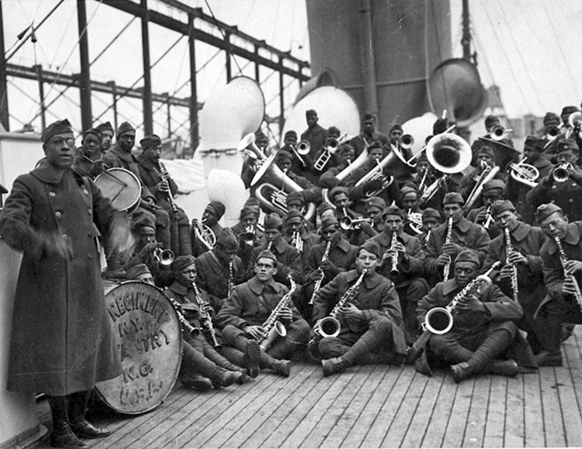 Lt. James Reese Europe, band director, far left, poses the jazz band of the 369th Infantry Regiment on the way home from war. Many music historians credit the music of the 369th for laying the foundation for the popularity of jazz music in France after the end of World War I.