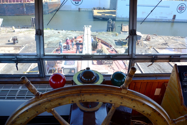 Members of the U.S. Army Corps of Engineers take part in an on-camera interview on the deck of the derrick boat Elizabeth