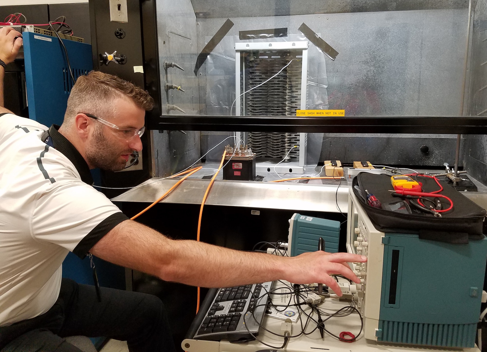Air Force Research Laboratory electrical engineer Corey Boltz makes final adjustments before conducting a proof-of-concept arc test in preparation for follow-up testing to support a NASA research effort. (U.S. Air Force Photo/Holly Jordan)
